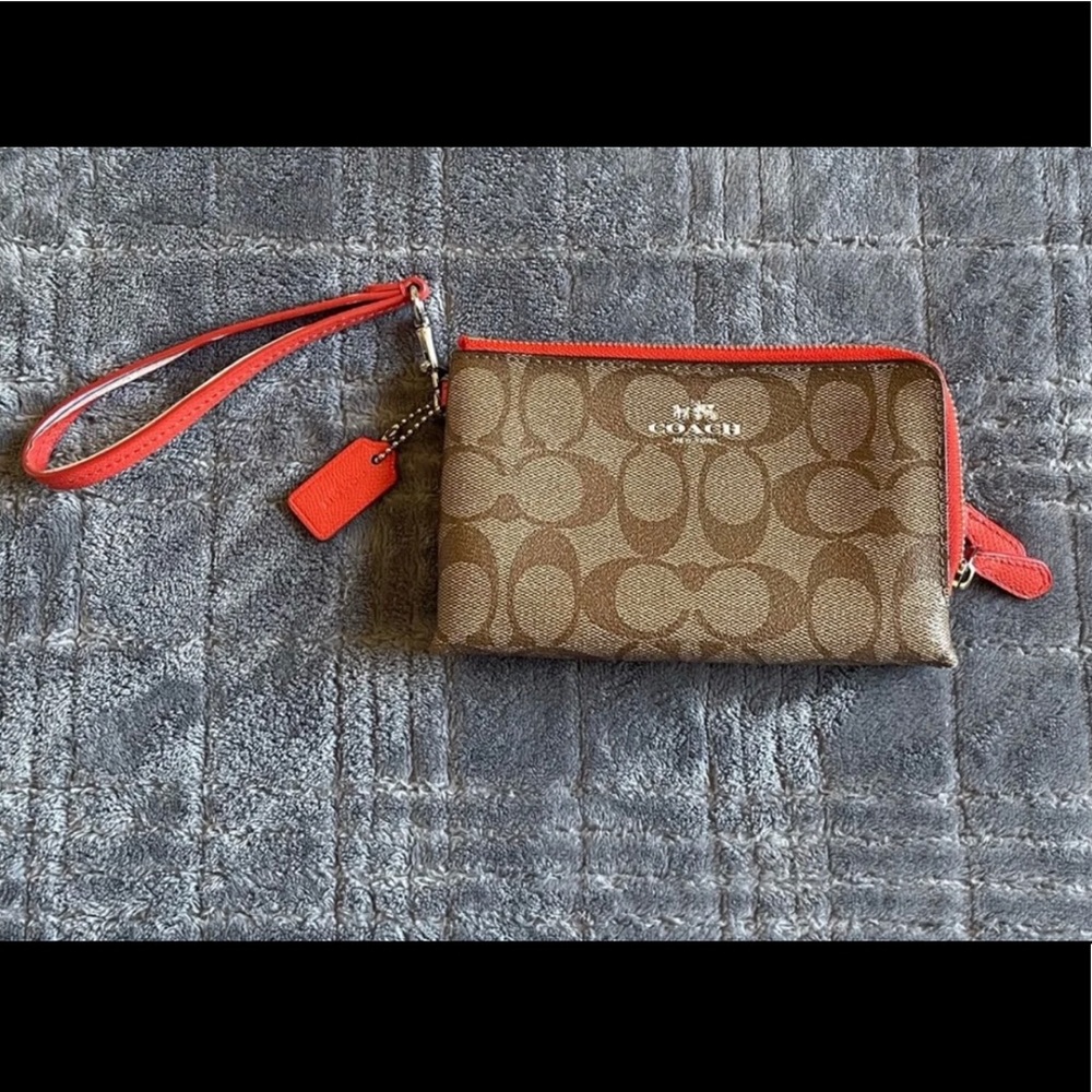 Coach wristlet. Brown with red.